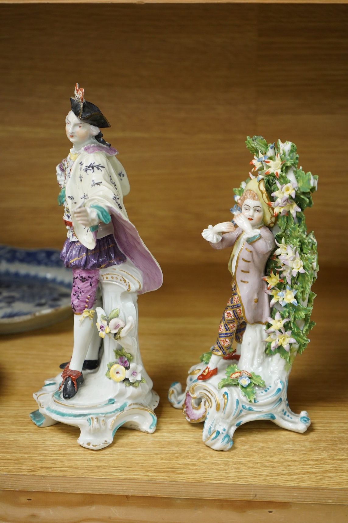 A Derby figure of a gentleman, c.1760, and a Continental porcelain figure, pseudo Bow mark, tallest 26cm high (2)